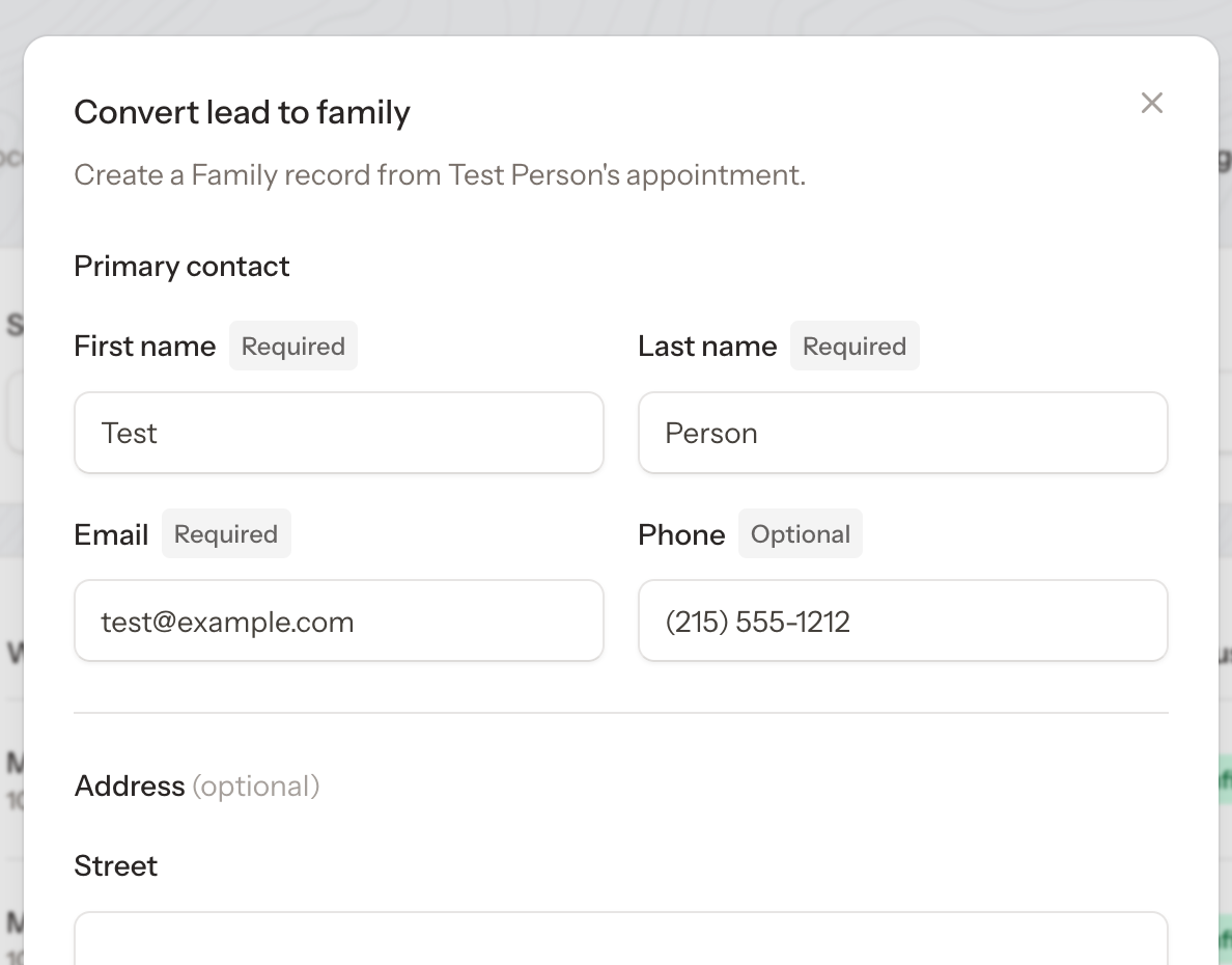 Convert lead modal pre-filled with contact info and a row to add a student inline